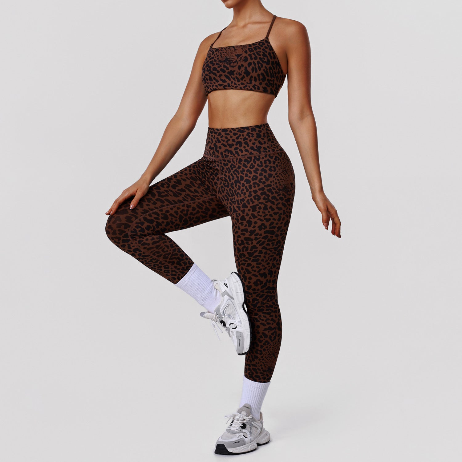 Leopard print high-waist yoga pants and matching fitness bra from Bella Mia, designed for exercise and stylish activewear.