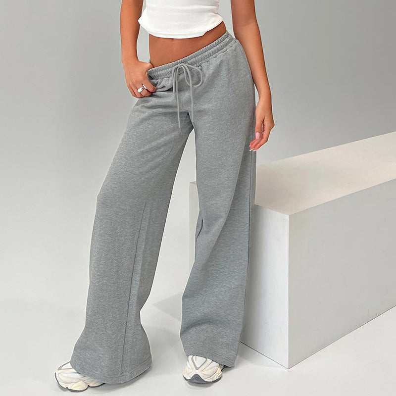 A pair of women's casual loose drawstring trousers from Bella Mia in solid color, featuring a tight waist and autumn style.