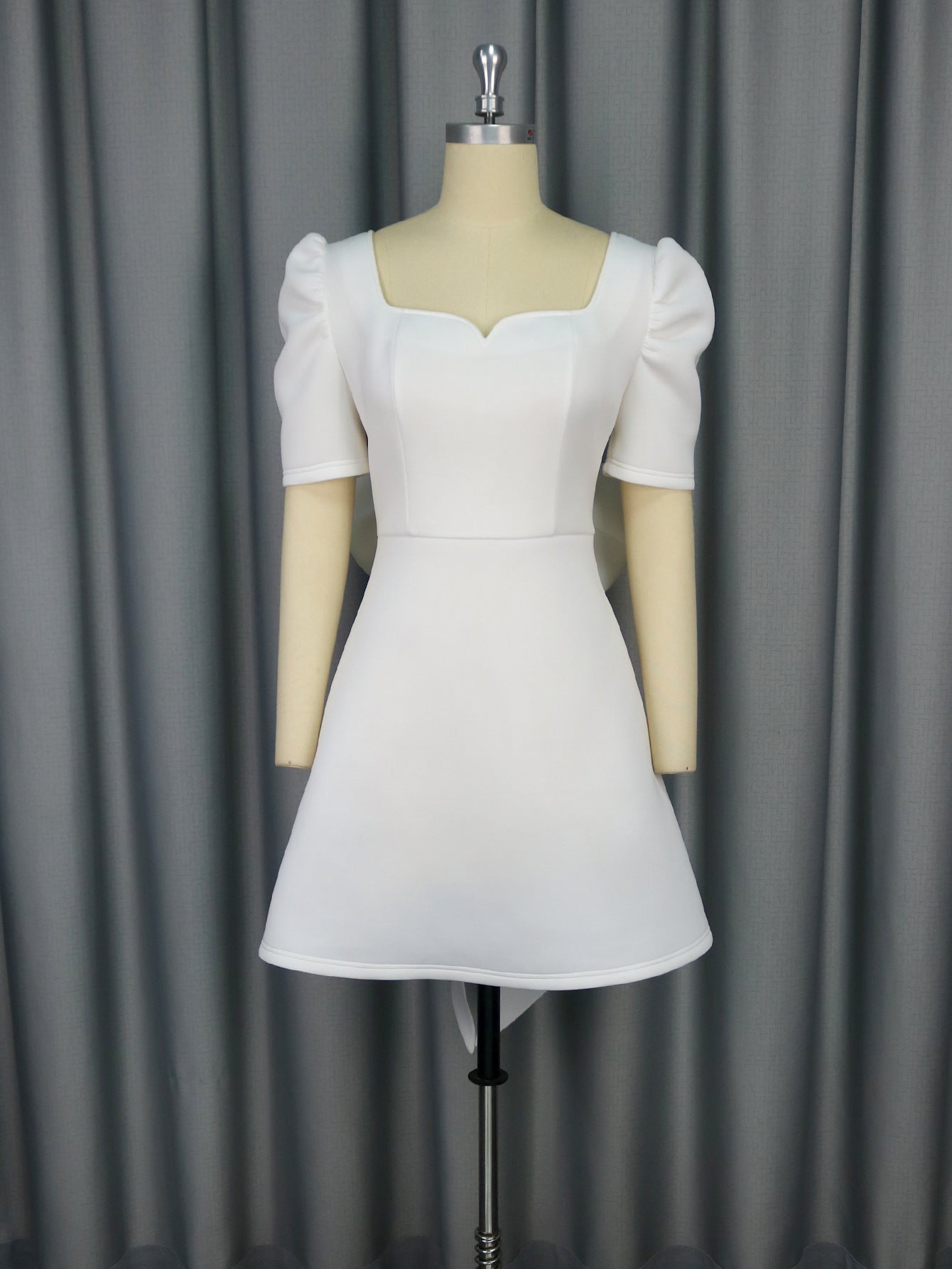 Backless summer elegance square collar dress with bow detail, ideal for parties, cocktails, or graduation events by Plush Fashion Hub.