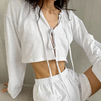 White cotton cardigan and lace-up pajama set by Bella Mia, featuring long sleeves and casual two-piece homewear for ladies.