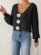 Women's knitted sweater top by Bella Mia with floral buttons, short coat style, and hand-hook decorative details.