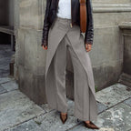 Bella Mia high waist women's trousers with irregular asymmetrical design, wide leg, casual spring fashion, jewelry rings.
