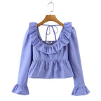 Bella Mia Summer Wind solid color long sleeve ruffled shirt, stylish women’s tops with feminine design and lightweight fabric.