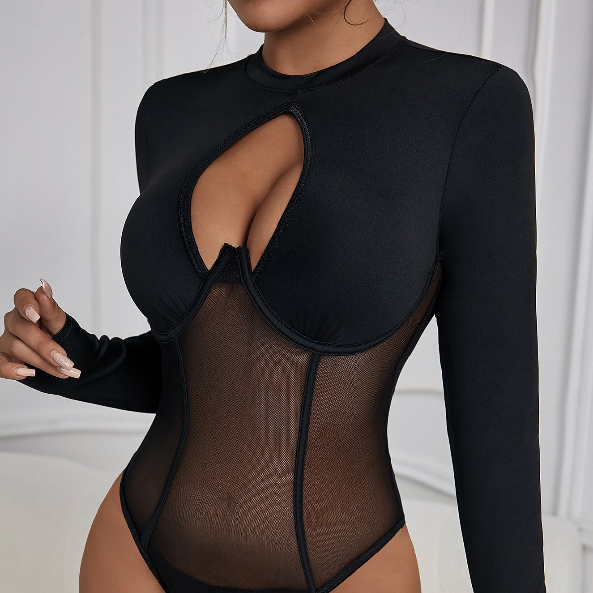 Backless black mesh jumpsuit with round neck, cutout details, slim fit, patchwork design, and built-in push-up inner for a sexy look.