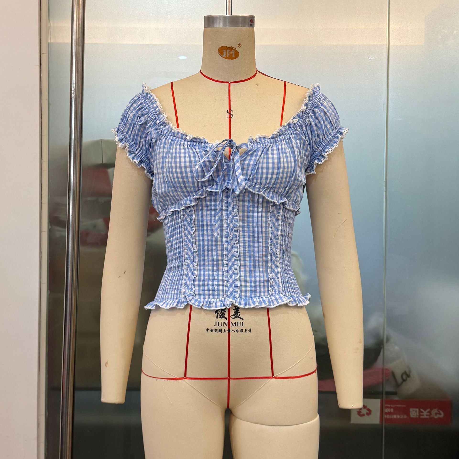 French plaid summer women's top from Plush Fashion Hub with puff sleeves, lace edges, and a short, sweet design.