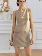 Women’s sleeveless dress by Plush Fashion Hub with rose front buttons, round neck, waist trimming, and elegant design.
