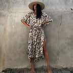 Printed long beach cover-up maxi dress by Plush Fashion Hub, featuring a flowing style perfect for sun protection and vacation wear.