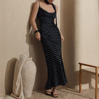 Polka dot strap maxi dress with halter top and fishtail design by Plush Fashion Hub, perfect for summer occasions.