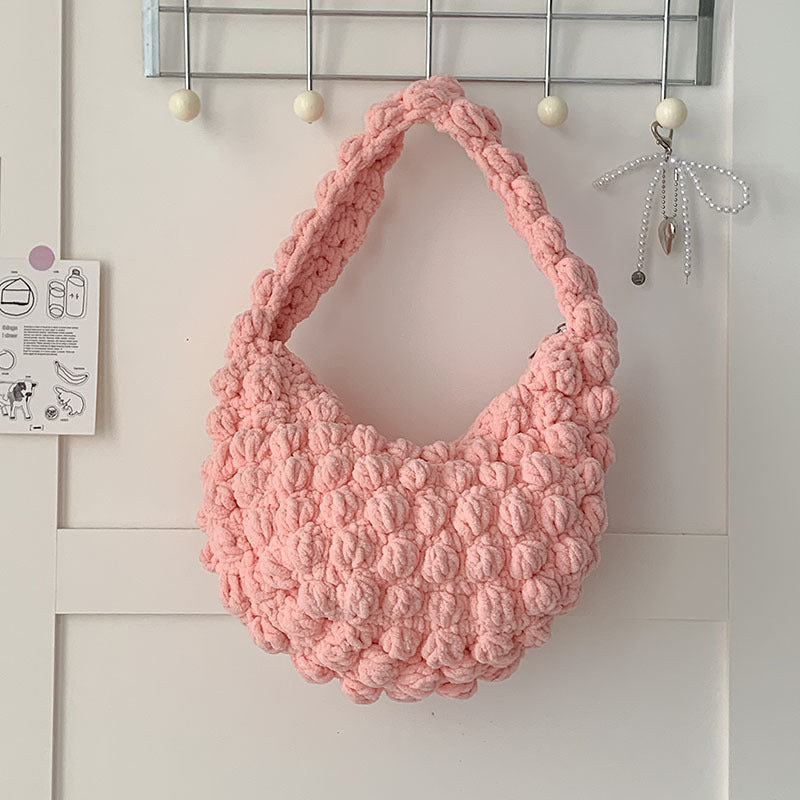 Handmade crocheted solid color beanie straw bag by Bella Mia, woven seaside beach bag with hand carry design for women.