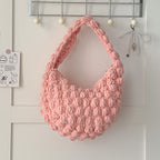 Handmade crocheted solid color beanie straw bag by Bella Mia, woven seaside beach bag with hand carry design for women.