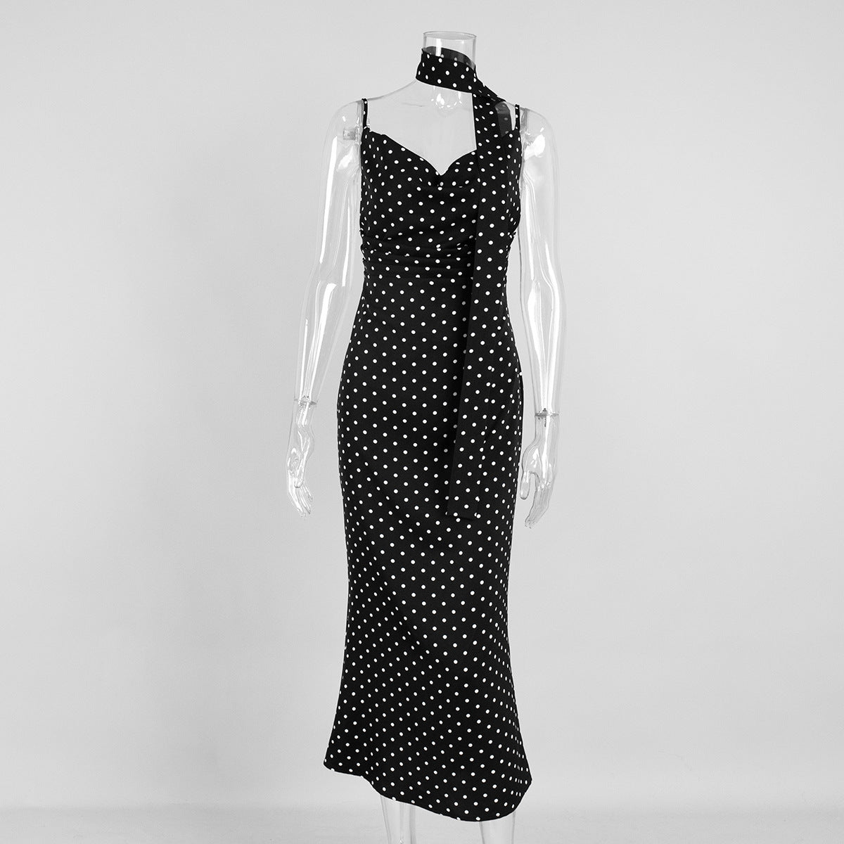 Plush Fashion Hub polka dot strap maxi dress with halter neckline and fishtail design, perfect for summer occasions.