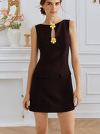 Women’s sleeveless elegant dress by Plush Fashion Hub with rose front buttons, round neck, and waist trimming.