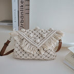 Bella Mia woven cotton beanie crossbody bag with tassels, straw material, perfect for beach or vacation shoulder bag.