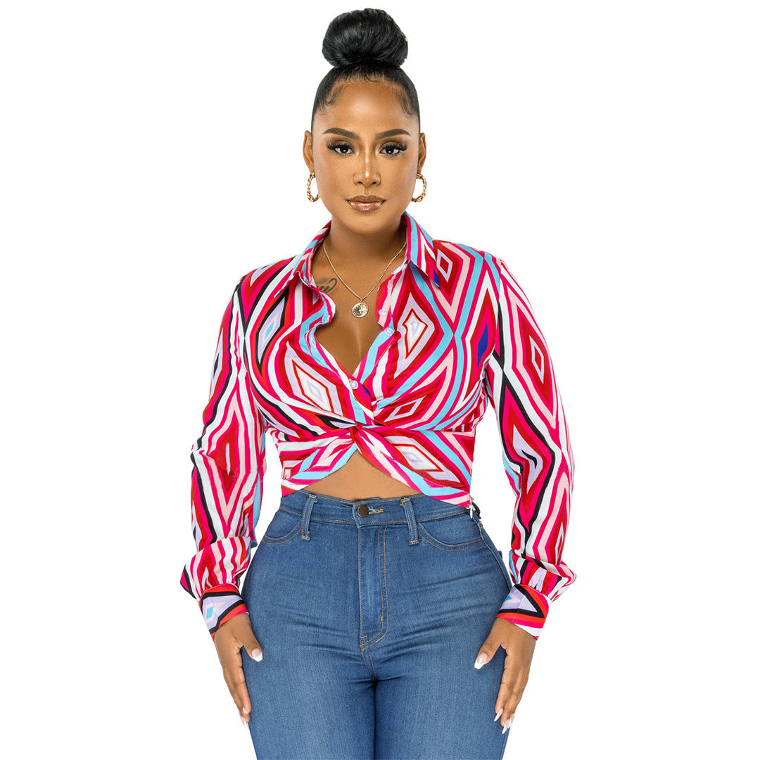 Women’s Bella Mia twist button shirt top with geometric pattern print, long sleeves, and a collared design.