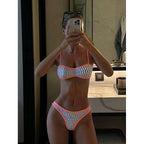 Bella Mia printed strap bikini two-piece swimsuit with ring accents, perfect for beach and seaside spring swimming.
