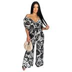 Women’s off-shoulder batwing sleeve wide-leg printed jumpsuit by Bella Mia, shown in a stylish, flowy design with bold print.