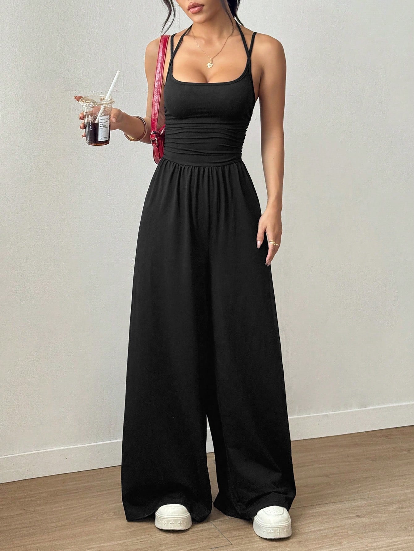 Casual women's summer jumpsuit by Plush Fashion Hub featuring wide-leg style, wrapped chest, and nipped waist.