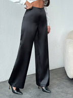 Women’s black satin wide-leg casual pants by Bella Mia, loose fit, stylish autumn bottoms with a relaxed silhouette.