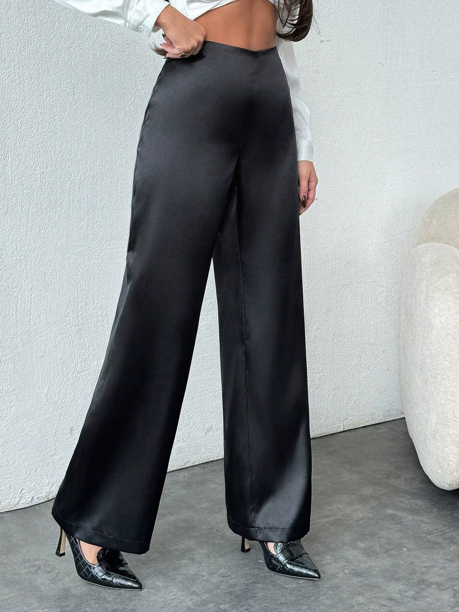 Women’s black satin wide-leg casual pants by Bella Mia, loose fit, stylish autumn bottoms with a relaxed silhouette.