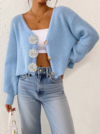 Women’s knitted floral cardigan by Bella Mia, short hipster sweater with decorative buttons and hand hook details.