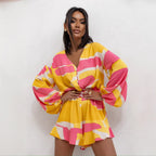 Women’s summer jumpsuit by Bella Mia with V-neck, printed long sleeves, waist trimming, ruffles, and shorts for a stylish look.
