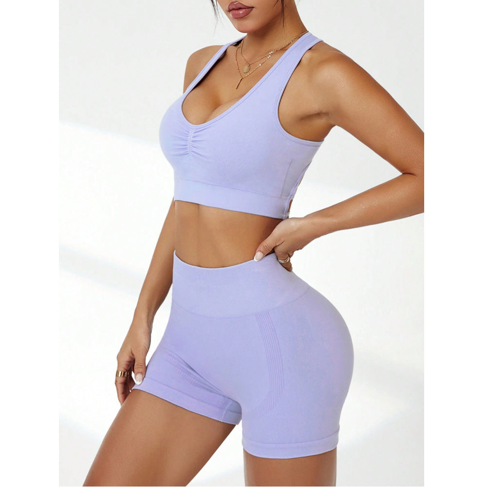Seamless peach hip shorts for women by Bella Mia, shockproof push-up yoga bottoms, ideal for workout and training exercises.