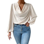 Loose draped V-neck long-sleeved shirt for women by Bella Mia, stylish top with relaxed fit and soft fabric.