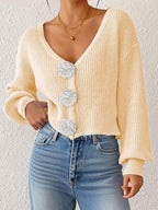 Women’s knitted floral cardigan by Bella Mia, short hipster top with decorative buttons and hand hook details.