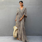 Printed long beach cover-up dress by Plush Fashion Hub with sun protection, perfect for vacation and swimwear styling.