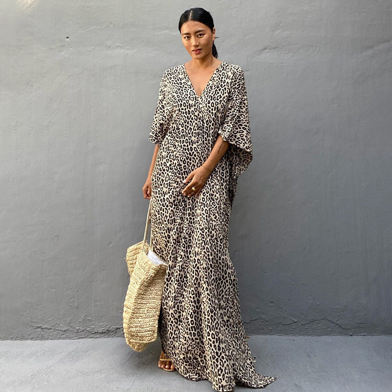 Printed long beach cover-up dress by Plush Fashion Hub with sun protection, perfect for vacation and swimwear styling.