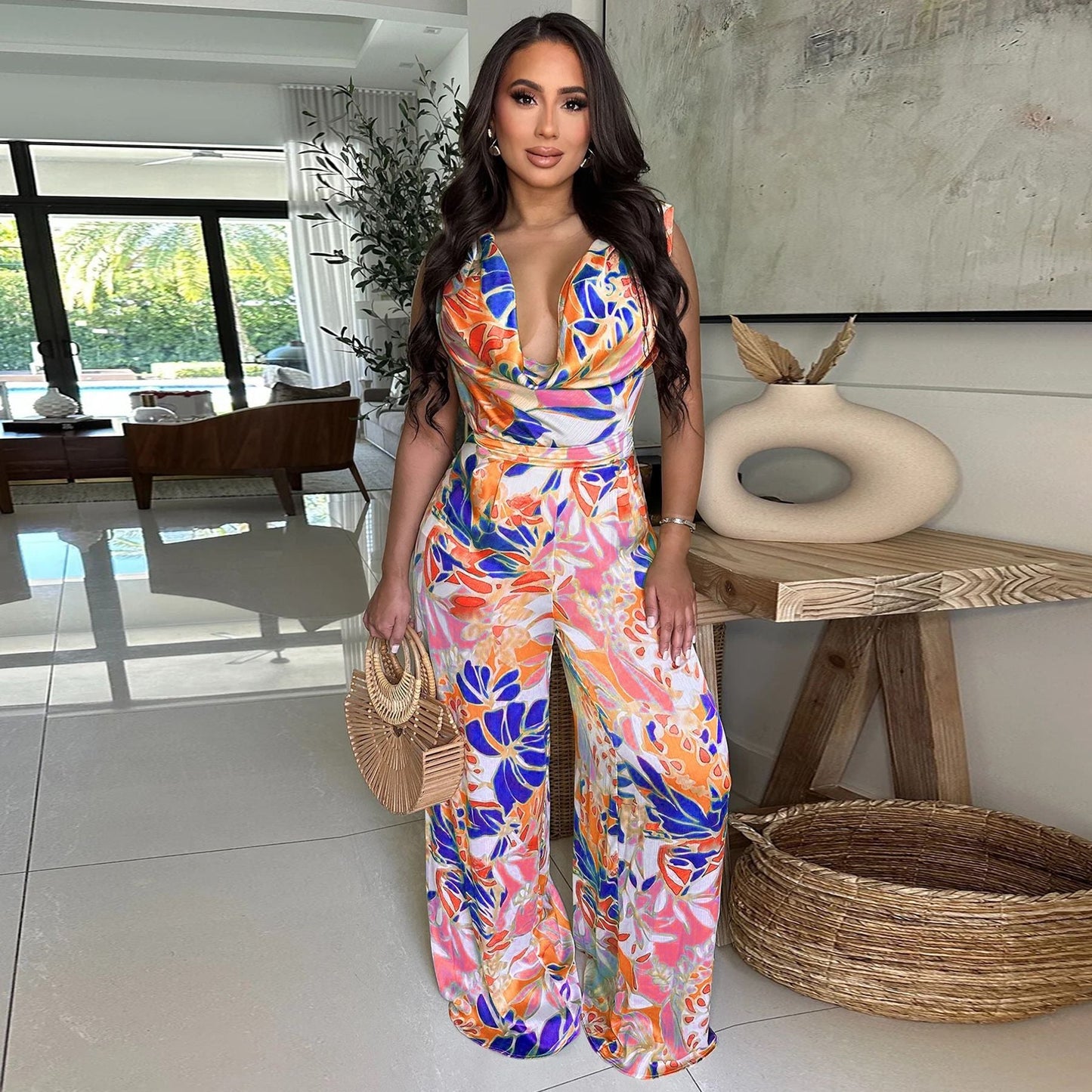 Women’s sleeveless lace-up wide-leg printed jumpsuit by Plush Fashion Hub, showing the stylish floral pattern and relaxed fit.