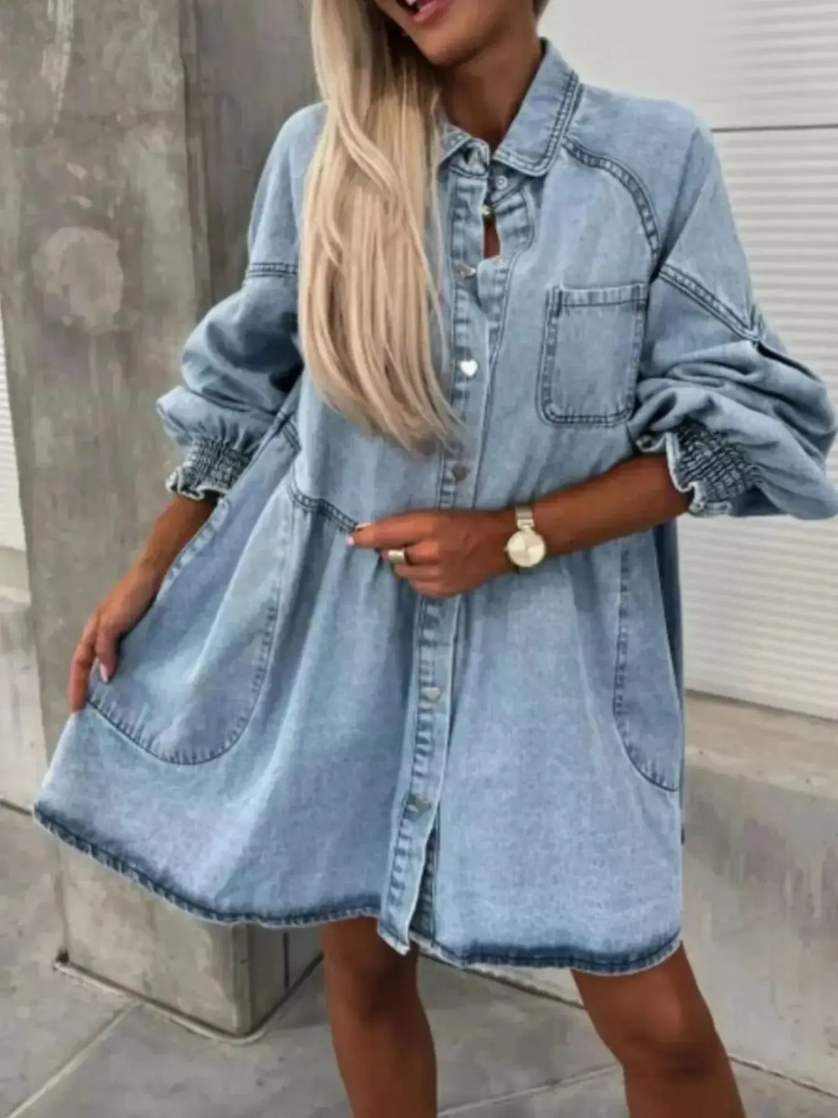 Oversized long sleeve denim button-up dress by Plush Fashion Hub, featuring a relaxed fit and classic denim fabric.