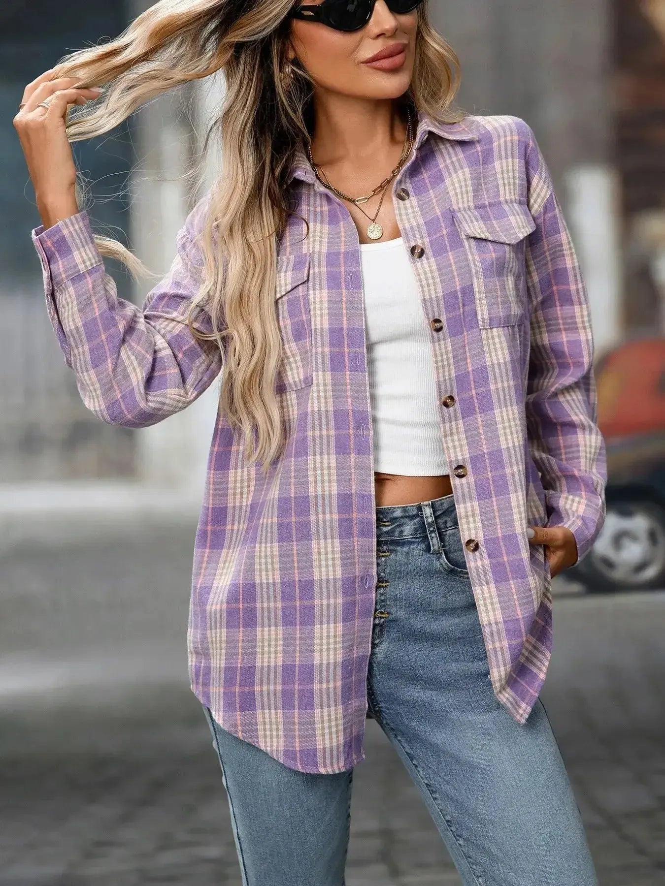Oversized women's plaid button-down shirt by Trendsi featuring soft flannel fabric, casual casual top with a relaxed fit.