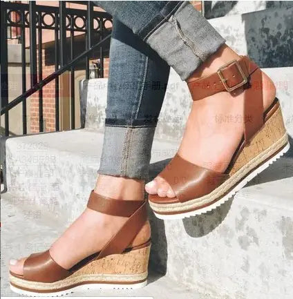 Women’s wedge heel sandals with buckle detail from Trendy Attic Store01, featuring open toe and ankle strap in neutral tones.