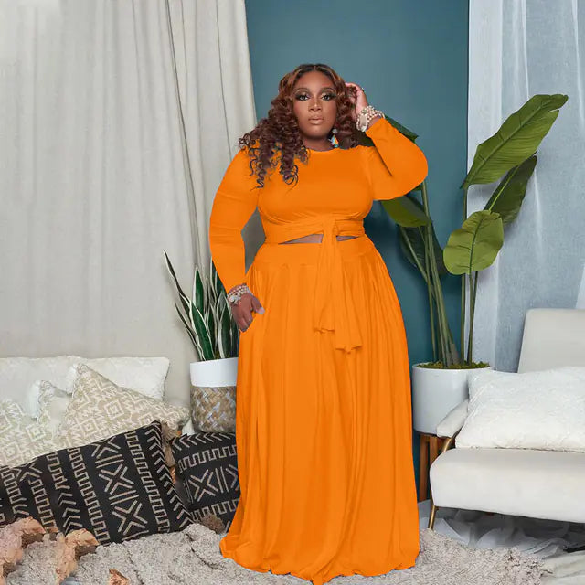 Plus size women's two-piece skirt set with long sleeves from Plush Fashion Hub, featuring a stylish and comfortable design.