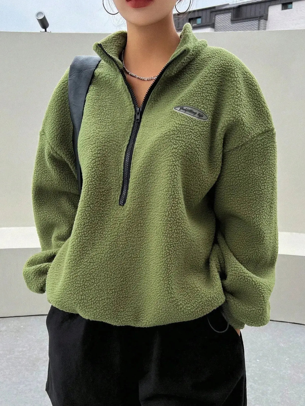 Women's half zip fleece sweatshirt with patch details and drop shoulder design from Plush Fashion Hub.