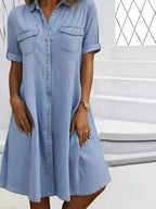 Plus size button-front short sleeve denim dress by Trendsi, casual midi style, featuring a flattering fit and classic denim fabric.