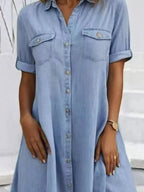 Plus size button-front short sleeve denim dress by Trendsi, casual midi style with flattering fit, denim fabric, and front button details.