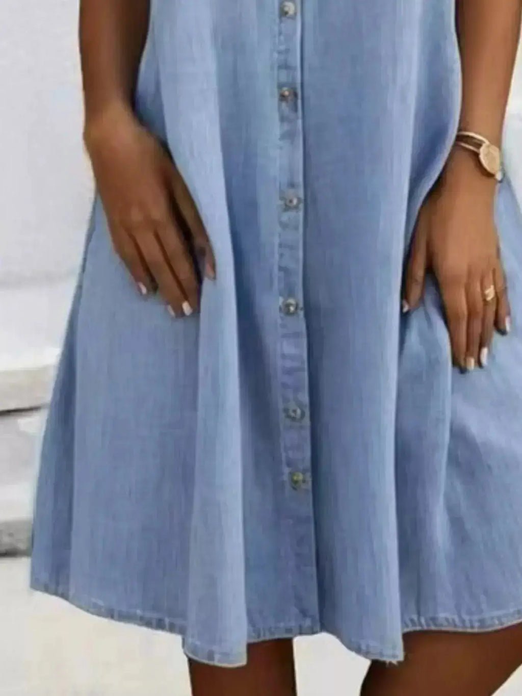 Plus size button-front short sleeve denim dress by Trendsi, casual midi style, featuring a flattering fit and classic denim fabric.
