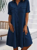 Plus size button-front short sleeve denim dress by Trendsi, casual midi style with flattering fit and classic denim look.
