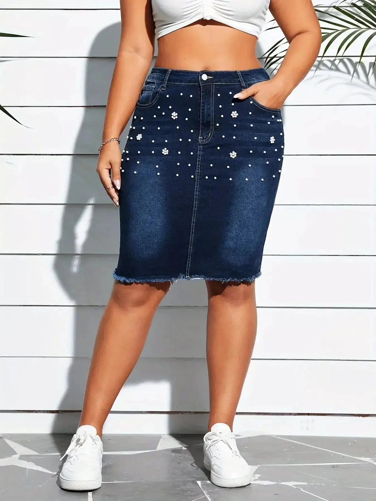 Plus size pearl-embellished frayed hem denim skirt by Plush Fashion Hub, showcasing stylish denim fabric and decorative pearl details.