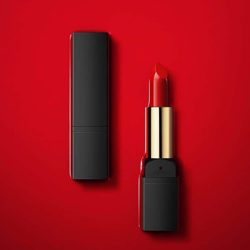 Plush Fashions Gentle Moisturizing Lipstick in vibrant red shade on a red background.