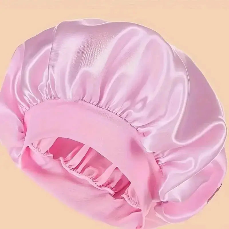 Plush Fashion Hub satin sleep bonnet with wide comfort band, designed for gentle hair protection during sleep.