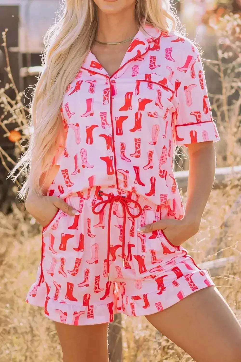 Printed button-down shirt and shorts pajama loungewear set by Trendsi, featuring a comfortable, stylish sleepwear ensemble.