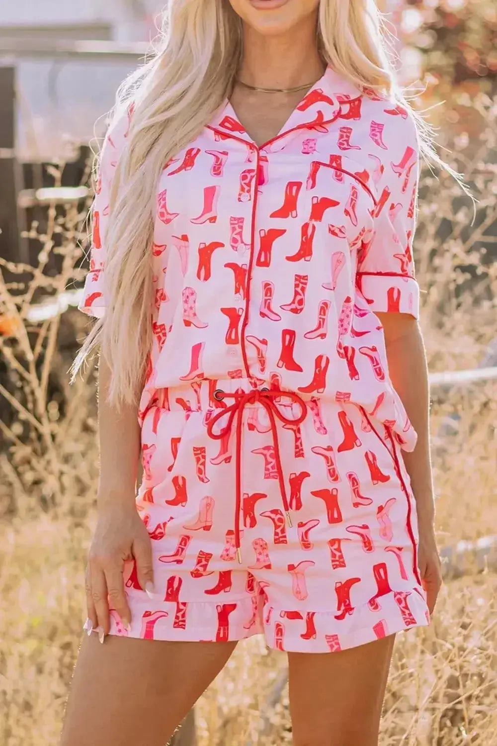 Printed button-down pajama shirt and shorts loungewear set by Trendsi, featuring a comfortable, casual sleepwear design.
