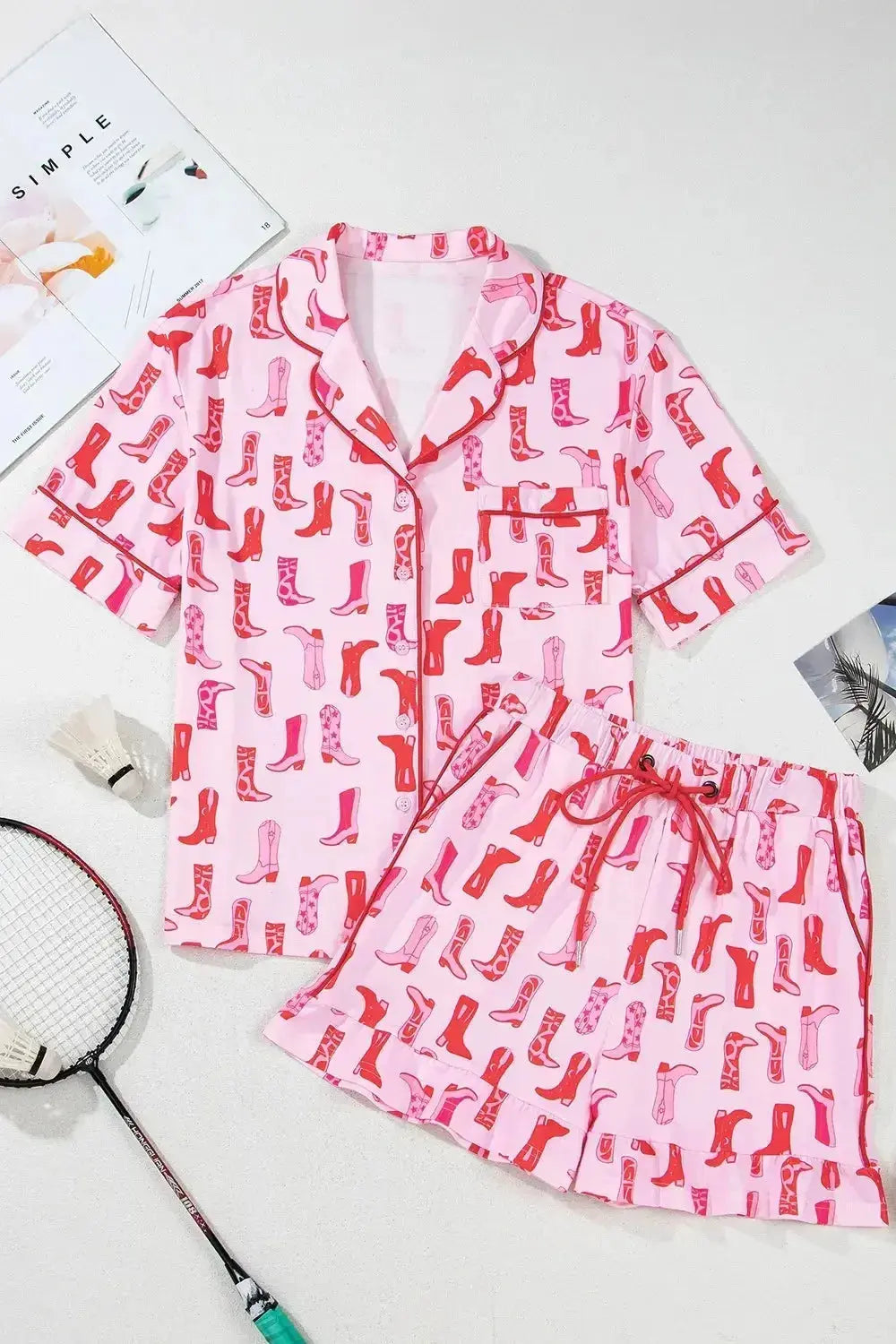 Printed button-down pajama shirt and shorts loungewear set by Trendsi, featuring a comfortable, lightweight fabric with a stylish print.