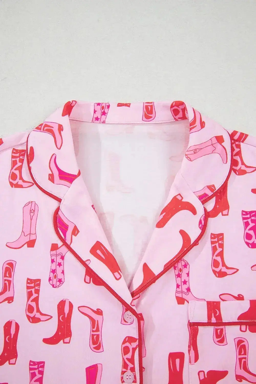Printed button-down shirt and shorts pajama loungewear set by Trendsi, featuring a comfortable, casual sleepwear design.
