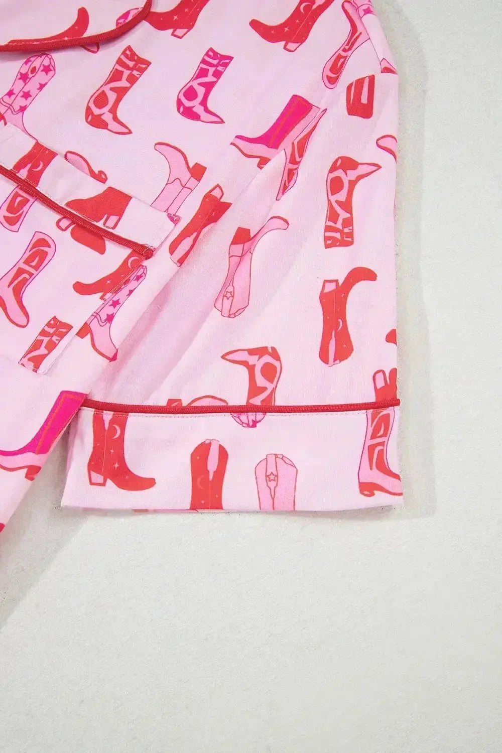Printed button-down pajama shirt and shorts loungewear set by Trendsi, featuring a comfortable, casual sleepwear ensemble.