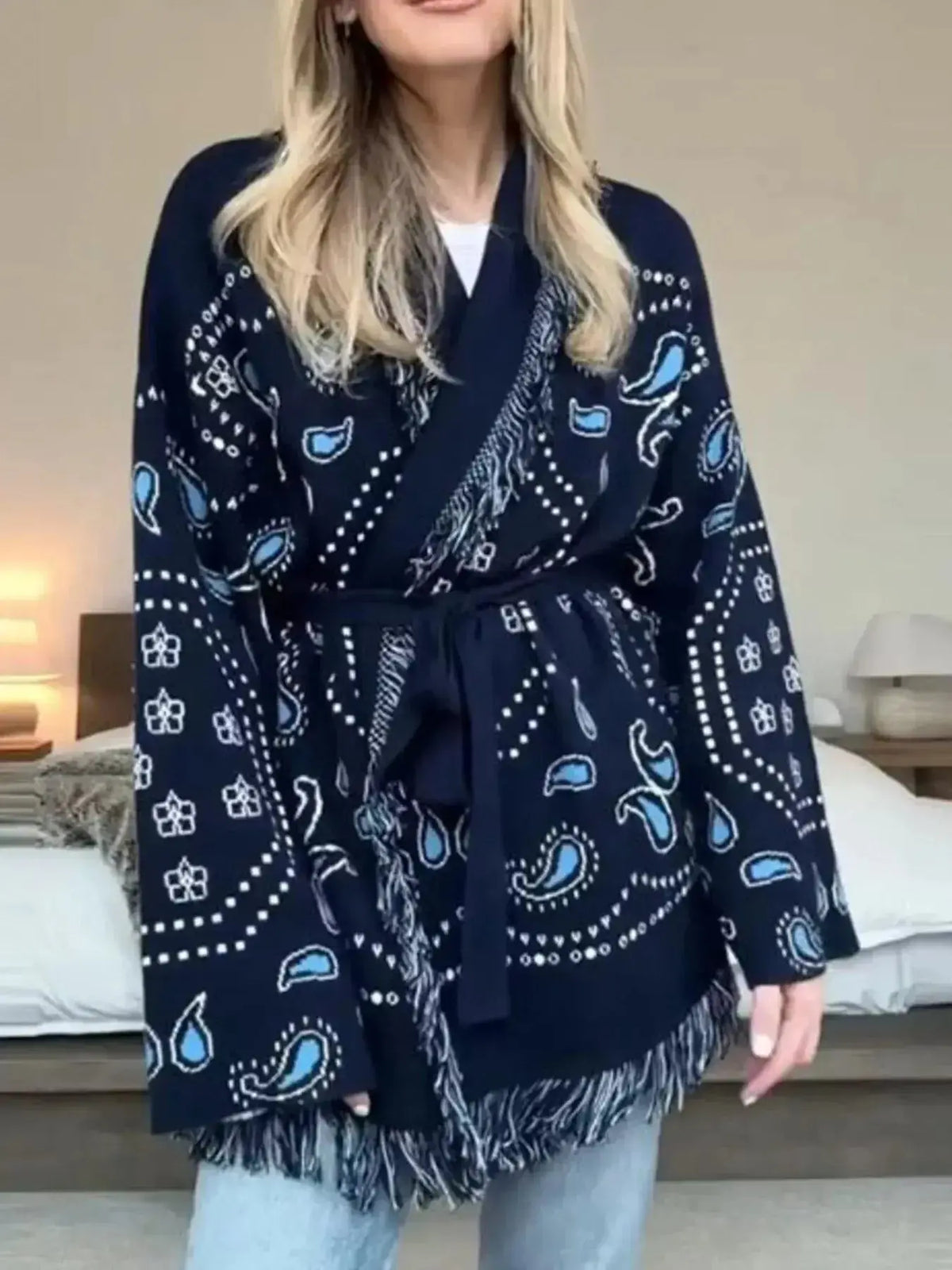 Bohemian printed fringe knit cardigan with long sleeves and tie front, from Plush Fashion Hub, styled as a trendy women's top.