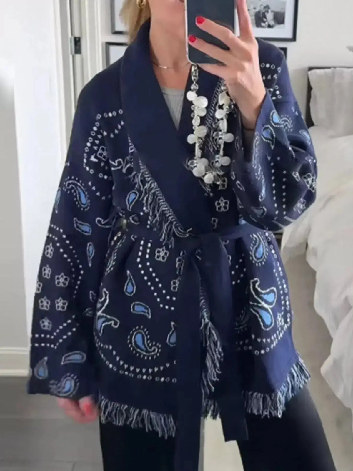 Bohemian printed fringe knit cardigan with tie front and long sleeves by Plush Fashion Hub, featuring a boho-inspired design.